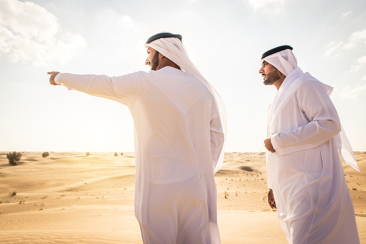 Arabian,Men,Witk,Kandora,Walking,In,The,Desert,-,Portrait